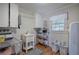 Laundry room with utility sink, washer, dryer, and ample storage at 294 Puckett Se Rd, Emerson, GA 30137