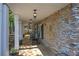 Covered front porch with stone columns and rocking chairs at 294 Puckett Se Rd, Emerson, GA 30137