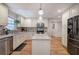 Kitchen with granite countertops, island, and stainless steel appliances at 294 Puckett Se Rd, Emerson, GA 30137