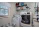 Laundry room with washer, dryer, shelving and storage at 294 Puckett Se Rd, Emerson, GA 30137