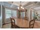 Elegant dining room featuring a spacious table, chandelier, and built-in hutch at 294 Puckett Se Rd, Emerson, GA 30137