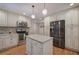 Modern kitchen with white cabinets, granite countertops and stainless steel appliances at 294 Puckett Se Rd, Emerson, GA 30137