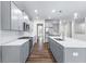 Modern kitchen with gray cabinets and large island at 6019 Wheeler Ridge Rd, Auburn, GA 30011