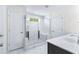 Bathroom with marble shower, built-in seat, and modern fixtures at 6019 Wheeler Ridge Rd, Auburn, GA 30011