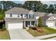 Two story home with gray siding and brick accents at 6019 Wheeler Ridge Rd, Auburn, GA 30011
