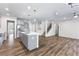 Open concept kitchen with island and hardwood floors at 6019 Wheeler Ridge Rd, Auburn, GA 30011