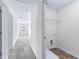 Hallway with carpet flooring and laundry closet at 6019 Wheeler Ridge Rd, Auburn, GA 30011