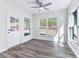 Sunroom with hardwood floors, door to backyard and lots of natural light at 6019 Wheeler Ridge Rd, Auburn, GA 30011