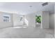 Large loft bedroom with neutral carpet and multiple windows at 6019 Wheeler Ridge Rd, Auburn, GA 30011