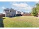 Large backyard with a grassy area and privacy fence at 6019 Wheeler Ridge Rd, Auburn, GA 30011