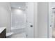 Clean bathroom with a tub shower combination, toilet and vanity at 6019 Wheeler Ridge Rd, Auburn, GA 30011