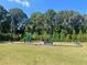 Community playground with play structures, swings, and benches at 6019 Wheeler Ridge Rd, Auburn, GA 30011