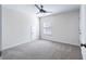 Simple bedroom with grey carpet and ceiling fan at 6019 Wheeler Ridge Rd, Auburn, GA 30011