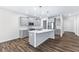 Modern kitchen with gray cabinets and large island at 6019 Wheeler Ridge Rd, Auburn, GA 30011