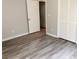 Bedroom with wood-look floors and built-in closet at 6190 Tucker Ln, Union City, GA 30291