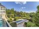 Landscaped grounds with manicured hedges and water features at 9620 Cedar Grove Rd, Chattahoochee Hills, GA 30213
