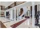 Two-story foyer with a sweeping staircase and elegant chandelier at 9620 Cedar Grove Rd, Chattahoochee Hills, GA 30213