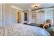 Serene bedroom with gray walls, large windows, and plush carpeting at 9620 Cedar Grove Rd, Chattahoochee Hills, GA 30213
