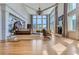 Spacious main bedroom with hardwood floors, fireplace, and large windows at 9620 Cedar Grove Rd, Chattahoochee Hills, GA 30213