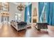 Living room with hardwood floors, fireplace and floor to ceiling windows at 9620 Cedar Grove Rd, Chattahoochee Hills, GA 30213