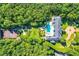 Luxury property featuring a pool, tennis court, and lush landscaping at 9620 Cedar Grove Rd, Chattahoochee Hills, GA 30213