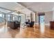 Bright living room with hardwood floors, fireplace, and comfortable seating at 9620 Cedar Grove Rd, Chattahoochee Hills, GA 30213