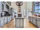 Spacious kitchen with gray cabinets, granite countertops, and an island at 9620 Cedar Grove Rd, Chattahoochee Hills, GA 30213