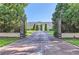 Private gated entrance to a luxurious property at 9620 Cedar Grove Rd, Chattahoochee Hills, GA 30213