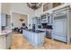 Spacious kitchen with gray cabinets, granite countertops, and a large island at 9620 Cedar Grove Rd, Chattahoochee Hills, GA 30213