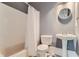 Bathroom with shower/tub combo, pedestal sink, and patterned tile floor at 9620 Cedar Grove Rd, Chattahoochee Hills, GA 30213