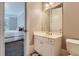 Clean bathroom with a vanity, toilet, and view of bedroom at 9620 Cedar Grove Rd, Chattahoochee Hills, GA 30213