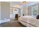 Comfortable bedroom with built-in shelving and seating area at 9620 Cedar Grove Rd, Chattahoochee Hills, GA 30213