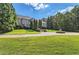 Grand estate home on landscaped lot with circular driveway and fountain at 9620 Cedar Grove Rd, Chattahoochee Hills, GA 30213