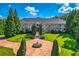 Grand estate home with circular driveway and fountain at 9620 Cedar Grove Rd, Chattahoochee Hills, GA 30213