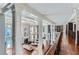 Grand two story foyer with hardwood floors, chandelier and balcony overlooking the living room at 9620 Cedar Grove Rd, Chattahoochee Hills, GA 30213