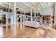 Two-story living room featuring hardwood floors, high ceilings, and a grand chandelier at 9620 Cedar Grove Rd, Chattahoochee Hills, GA 30213