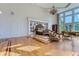 Spacious main bedroom with hardwood floors, large windows, and a sitting area at 9620 Cedar Grove Rd, Chattahoochee Hills, GA 30213