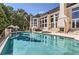 Inviting pool with spacious patio and outdoor fireplace at 9620 Cedar Grove Rd, Chattahoochee Hills, GA 30213