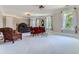 Elegant bedroom featuring a dark wood bed frame and red accent chair at 9620 Cedar Grove Rd, Chattahoochee Hills, GA 30213