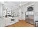 Large kitchen with stainless steel appliances, white cabinetry, and hardwood floors at 1323 Briarcliff Ne Rd, Atlanta, GA 30306