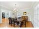Formal dining room features hardwood floors, a chandelier, and a large wooden table at 1323 Briarcliff Ne Rd, Atlanta, GA 30306
