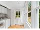 Laundry room with washer, dryer and exterior access at 1323 Briarcliff Ne Rd, Atlanta, GA 30306