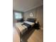 Bright bedroom with a queen bed, desk, and hardwood floors at 1323 Briarcliff Ne Rd, Atlanta, GA 30306