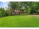 Brick home with lush green lawn and driveway at 1323 Briarcliff Ne Rd, Atlanta, GA 30306