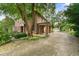 Brick home with driveway, landscaping and detached garage at 1323 Briarcliff Ne Rd, Atlanta, GA 30306