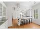 White kitchen with island, granite countertops, and hardwood floors at 1323 Briarcliff Ne Rd, Atlanta, GA 30306