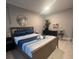 Bedroom with a queen bed and dresser at 1323 Briarcliff Ne Rd, Atlanta, GA 30306