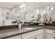 Bathroom with double vanity, dark countertop, and elegant design at 3749 Tielman St, Snellville, GA 30078