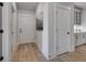 Bright hallway with hardwood floors and neutral walls at 3749 Tielman St, Snellville, GA 30078