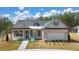 Brick and shingle two-story house with landscaping and a two-car garage at 3749 Tielman St, Snellville, GA 30078